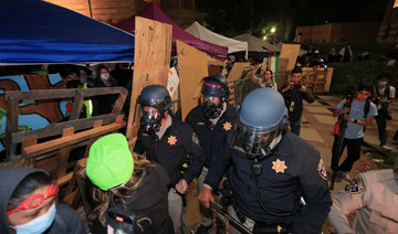 CHP officers walk near an encampment by supporters of Palestinians in Gaza, on the UCLA campus, in Los Angeles, California, US.