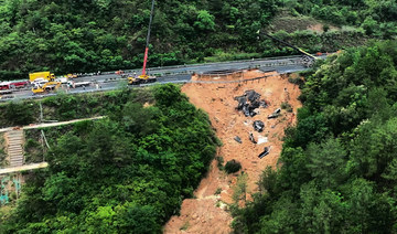 Death toll jumps to at least 48 as a search continues in southern China highway collapse