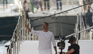 Olympic torch begins journey across France after festive welcome in Marseille before Summer Games