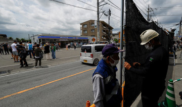 Swarmed with tourists, Japan town blocks off viral view of Mt. Fuji