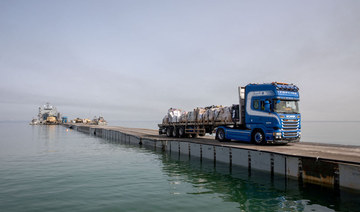 More aid getting from US pier to people in Gaza, officials say, after troubled launch