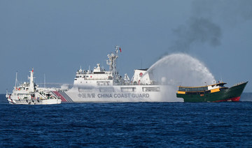 China says it saw armed Philippine personnel on vessel in disputed South China Sea