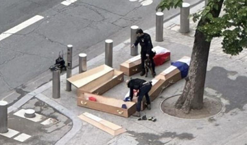 France arrests three after coffins left at Eiffel Tower