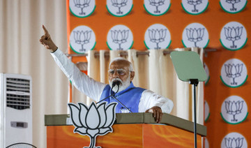 India's Prime Minister Narendra Modi gestures as he addresses supporters during an election campaign rally, in New Delhi, India.