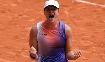 Swiatek dismantles Paolini to win third straight French Open title