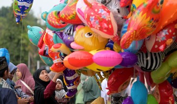 Muslims in Asia celebrate Eid Al-Adha with sacrifice festival and traditional feast