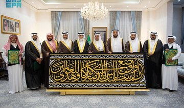 The Kaaba’s Kiswa was handed over to the gatekeeper of the holy site on Monday. (SPA)