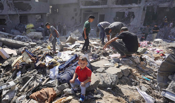 Palestinian residents search the rubble of a family home destroyed in Israeli strikes in the central Gaza Strip on Tuesday. (AFP