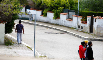Young Sikh migrant workers walk on a street in the Agro Pontino area, south of Rome. Picture taken May 19, 2019 (REUTERS)