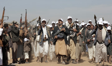 Houthi fighters march during a rally of support for the Palestinians in the Gaza Strip and against the US strikes on Yemen.