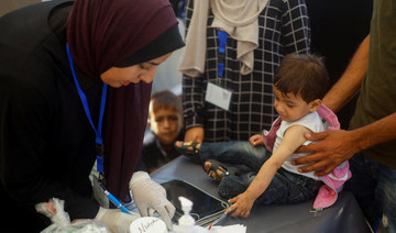 A malnourished Palestinian boy receives treatment at the International Medical Corps field hospital in Deir Al-Balah.