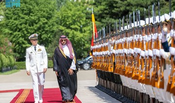 Saudi Defense Minister Prince Khalid bin Salman is received by his Chinese counterpart Dong Jun in Beijing on Tuesday. (SPA)