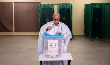 Incumbent Mauritanian President Mohamed Ould Ghazouani casts his ballot at a polling station in Nouakchott on June 29, 2024. AFP