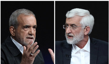 Masoud Pezeshkian (L) and Saeed Jalili attend an election debate at a television studio in Tehran, Iran July 2, 2024. (REUTERS)