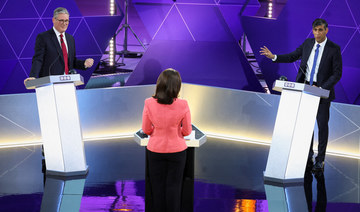 Labour Party leader Keir Starmer and Britain’s Prime Minister and Conservative Party leader Rishi Sunak attend a live TV debate.