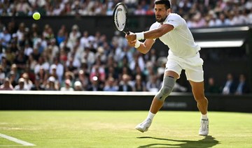 Djokovic into Wimbledon third round after rookie scare