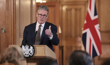 British Prime Minister Keir Starmer delivers a speech, following his first cabinet meeting as Prime Minister, in London.