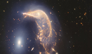 Webb Space Telescope’s latest cosmic shot shows pair of intertwined galaxies glowing in infrared