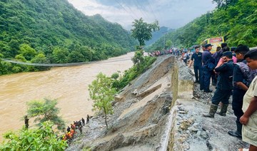 Nepal recovers first body from buses swept away by landslide