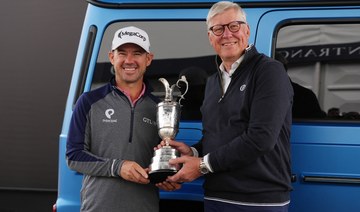 Brian Harman starts his British Open title defense by returning the claret jug