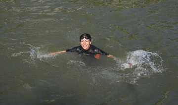 Paris mayor dips into the Seine River to showcase its improved cleanliness before Olympic events