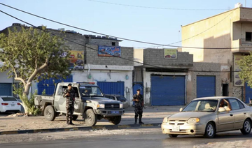 Security personnel affiliated with the Ministry of Interior secure the streets after clashes between armed factions in Tripoli.