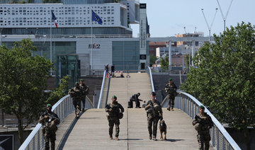 Central Paris locks down for Olympics as athletes arrive