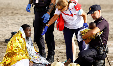 Exhausted migrants arrive on beach in Spain’s Canaries