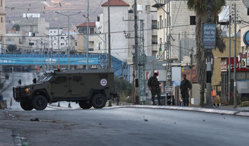 Israeli security forces close-off a main entrance to Huwara town in the occupied West Bank following attacks by Israeli settlers