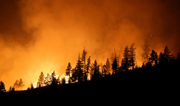 Thousands forced to flee western Canadian town as wildfires approach