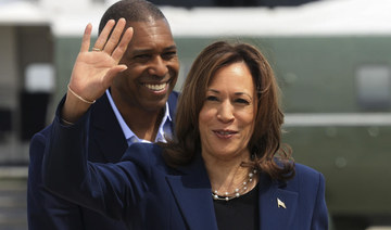 Vice President Kamala Harris waves before boarding Air Force Two as she departs on campaign travel to Milwaukee, Wisc.