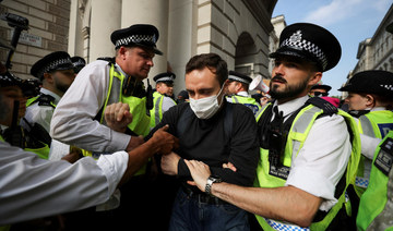 Police officers remove ‘Workers for a Free Palestine’ demonstrators in London.