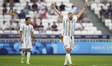 Iraq's Aymen Hussein celebrates after scoring against Ukraine during the 2024 Summer Olympics. AP
