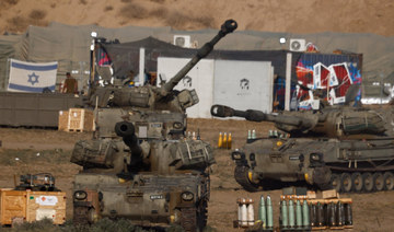 Israeli mobile artillery units stand near the Israel-Gaza border, amid the conflict between Israel and Hamas, in Israel, July 25