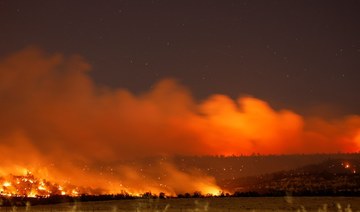 Thousands flee fast-spreading wildfire in northern California