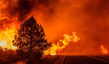 California’s largest wildfire explodes in size as fires rage across US West