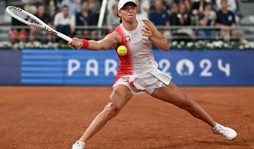 Iga Swiatek starts the 2024 Olympics tennis event with a win at the site of her French Open triumphs