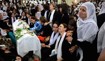 Druze women mourn by a coffin during a funeral of a person killed in a rocket strike from Lebanon a day earlier in Golan Heights