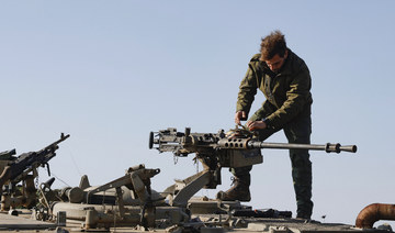 An Israeli soldier checks a weapon at a position in the Israel-annexed Golan Heights near the border with Syria. (File/AFP)