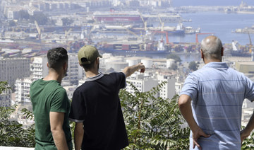 A youth point towards the ports in Algiers, Algeria, Monday, July 29, 2024. (AP)