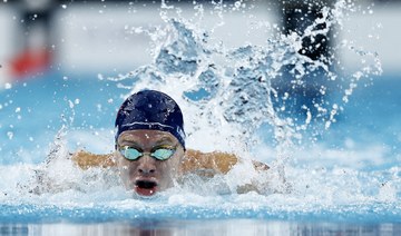 Leon Marchand captures 4th Olympic swimming gold, setting off a party across Paris