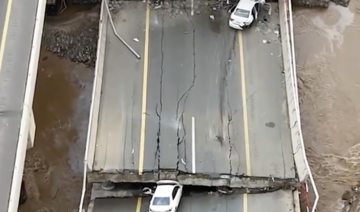 Al-Ekhbariya aired images of two vehicles caught up in the floodwaters, one of them crushed by a collapsed bridge support.