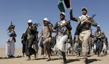 Houthi fighters march during a rally of support for the Palestinians in the Gaza Strip and against the US strikes on Yemen.