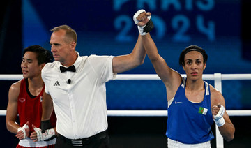 Boxer in Olympics gender row moves into final, Thomas flies to 200m gold