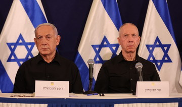 Israeli Prime Minister Benjamin Netanyahu and Defense Minister Yoav Gallant attend a press conference in the Kirya military base