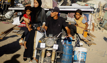 Displaced Palestinians flee the eastern part of Khan Younis following an Israeli army evacuation order.