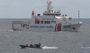 Philippines says China air force harassed its plane over disputed reef