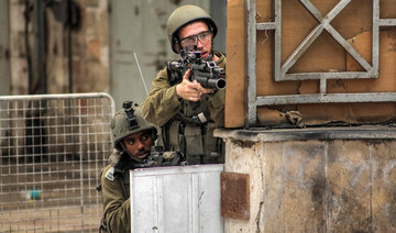 Israeli soldiers take aim during clashes in the centre of Hebron in the occupied West Bank on July 4, 2023. (AFP file photo)