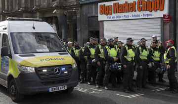 Police forces with riot gear prepare for a far-right anti-immigration protest in Newcastle, England, Saturday, Aug. 10, 2024.(AP