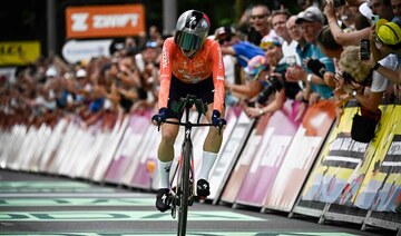 Defending women’s Tour de France champion Demi Vollering wins time trial and takes overall lead